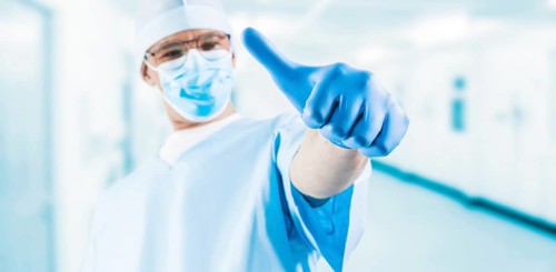 The doctor in the medical center shows a raised finger. Medicine concept.
