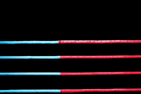Boxing ring ropes on a black background. The concept of sports