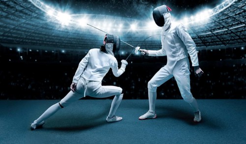 Portrait of two fencers against the backdrop of a sports arena. The concept of fencing. Duel.