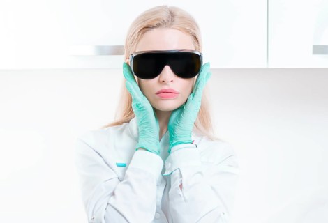 Portrait of a girl in black glasses for laser hair removal. Concept of cosmetology
