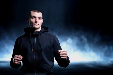 Young kickboxer posing in the studio. The concept of martial arts