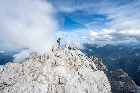 Mountaineer on a narrow rocky ridge