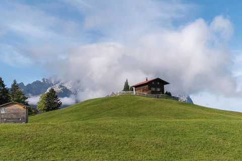 Hill with wooden house