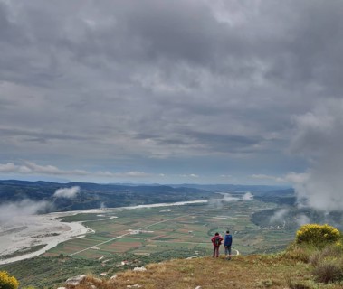 Two visitors marvelling at the view of the Vjosa valley from the Illyrian hilltop settlement of Byllis
