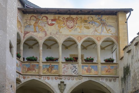 Depiction of a jousting tournament above the arcade