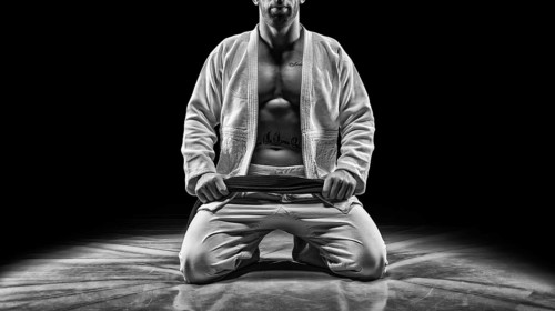 Professional athlete sits in the gym. Concept of karate
