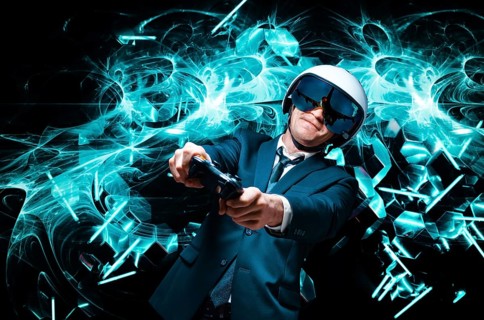 Portrait of a man in a suit and helmet of a pilot with a joystick in his hands. He enthusiastically plays a computer game. Game space. Game concept.