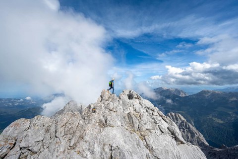 Mountaineer on a narrow rocky ridge