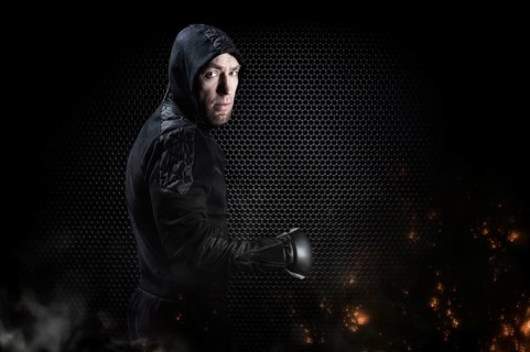 Mixed martial artist goes to battle in a sweatshirt. Concept of mma