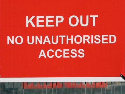 Keep Out No Unauthorised Access warning sign in a construction site