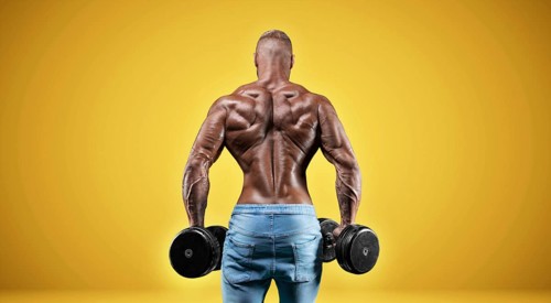 Isolated professional sportsman on a yellow background. Bodybuilding concept. Panorama. Advertising of a gym and sports nutrition.