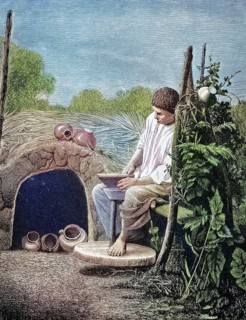 Russian potter at work at the potter's pane