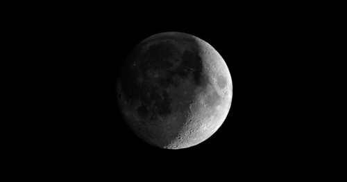 Waxing crescent moon seen with telescope