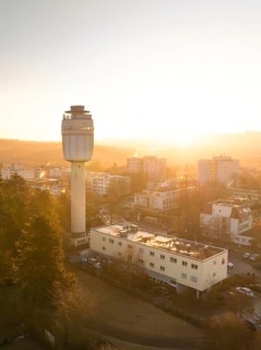 Sunrise behind a water tower
