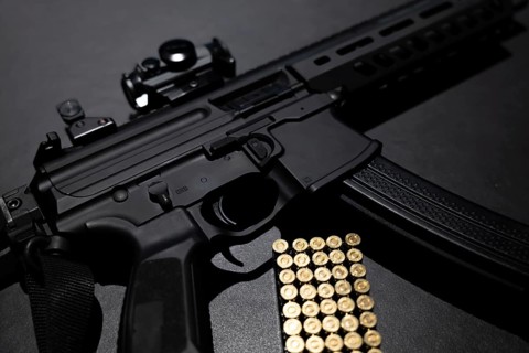 Modern Elegant Assault Rifle and Bullet on Grey Background in Switzerland
