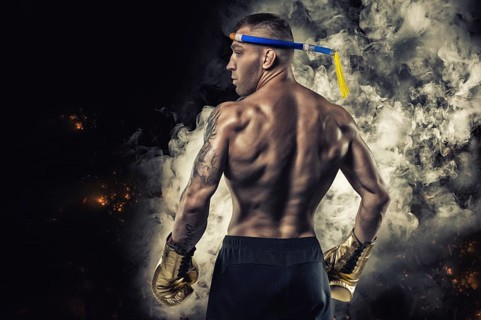 Portrait of a Thai boxer. Back view. Mixed martial arts concept. Competitions and tournaments
