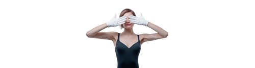 Beautiful young woman in white gloves covered her eyes with her hands