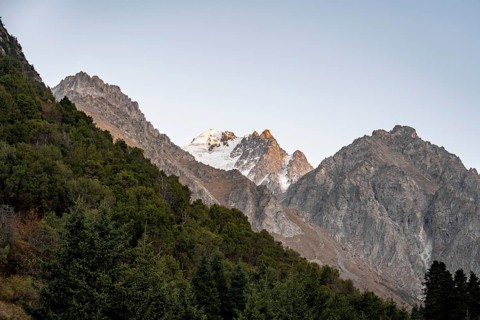 Glaciated mountain peak at sunset