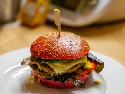 Delicious veggie burger in a beetroot bun