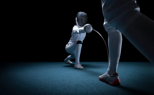 Two fencers are fighting in a tournament. The concept of fencing.