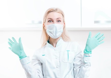 Portrait of a blonde girl in a mask. Coronavirus epidemic concept. Pandemic.