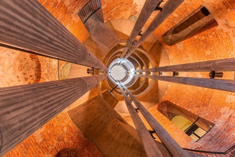 View upwards inside a spiral tower with columns