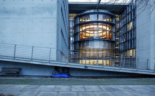 A homeless man sleeps in a sleeping bag at the Paul Loebe Haus. Aid organisations register an increase in homeless people