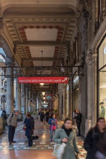 Arcade with floor mosaic on Via XX Settembre