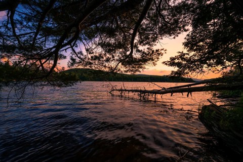 Summer Solstice Sunset on a lake in Catskills Mountains