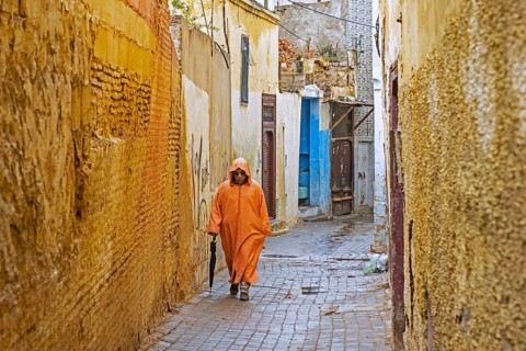 Muslim man wearing orange djellaba