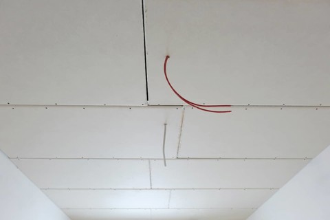 Plasterboard panels under the ceiling