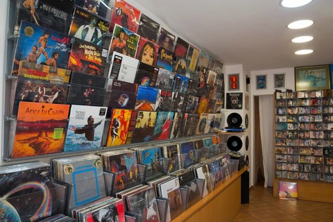 Interior view of a music shop with a wide selection of vinyl records and CDs