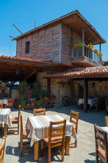 Traditional wooden windmill with terrace and seating