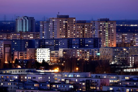 View in the evening at blue hour of high-rise buildings and apartment blocks with rental flats and condominiums in the Berlin district of Marzahn-Hellersdorf