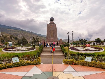 Tourists in front of the equator monument Ciudad Mitad del Mundo