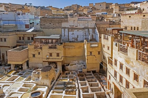 Sidi Moussa Tannery with round stone vessels filled with dye and softening liquids in medina Fes el-Bali of the city Fes
