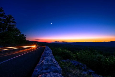Sun sets behind the Catskills Mountains