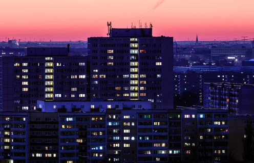 View in the evening at blue hour of high-rise buildings and apartment blocks with rental flats and condominiums in the Berlin district of Marzahn-Hellersdorf