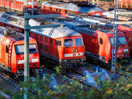 DB Cargo class 185 and class 232 locomotives standing in the DB Cargo marshalling yard in Halle