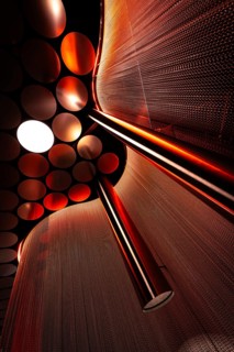 Close-up of a red light installation with spheres and reflections