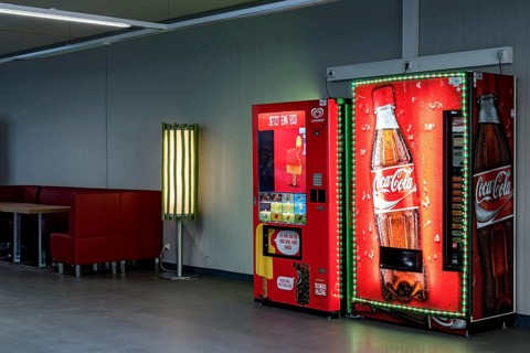 Vending machines for Langnese ice cream and Coca-Cola soft drinks in a waiting room