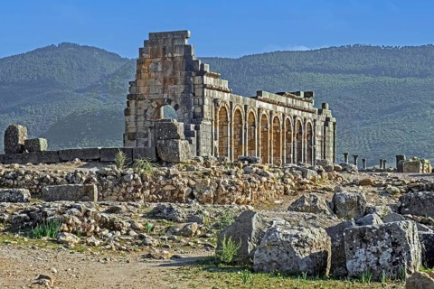 Arched outer wall of basilica faced with columns at Volubilis