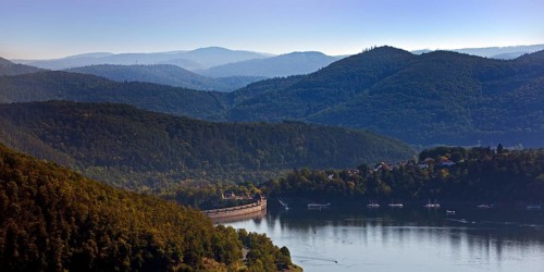 Elevated view of the Edertalsperre dam with the dam wall and a wide view of the Kellerwald-Edersee National Park