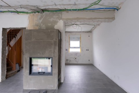 Room with newly laid electrical cables under the ceiling