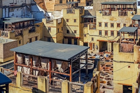 Sidi Moussa Tannery with round stone vessels filled with dye and softening liquids in medina Fes el-Bali of the city Fes