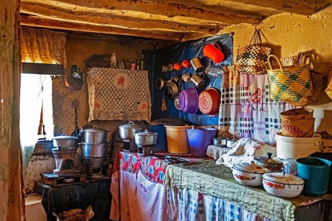 Interior of Betsileo house showing kitchen with pots and cooking utensils in the Haute Matsiatra Region