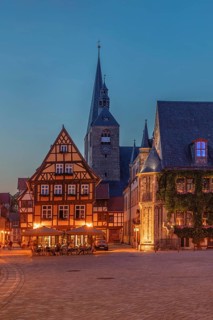 Cafe on the market square with St Benedikti church and town hall