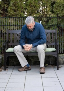 Man with grey hair and a full beard