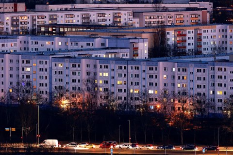 View in the evening at blue hour of high-rise buildings and apartment blocks with rental flats and condominiums in the Berlin district of Marzahn-Hellersdorf