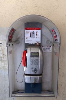 Public telephone booth under arcades